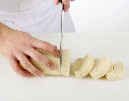 Shaping palmiers is all about precision and care.