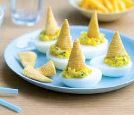Delicious Bacon Soufflé-Stuffed Eggs served as an elegant appetizer with a fluffy texture and crispy bacon.