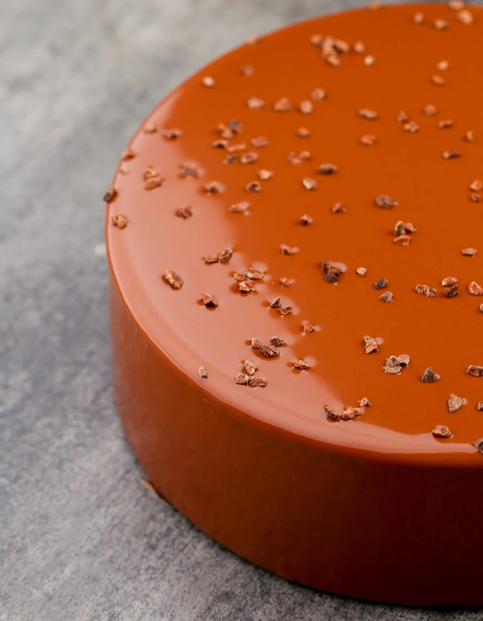 Pouring vanilla crémeux layer on Entremet Racine sponge cake